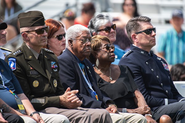Medal_of_Honor_recipient_Melvin_Morris_and_his_wife_sit_with_other_distinguished_guests_during_the_Welcome_Home_Opening_Ceremony.